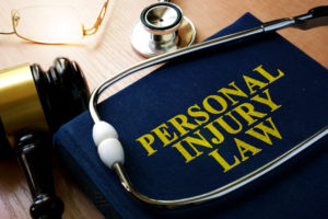 stethoscope and gavel with a personal injury law book on the desk of a Personal Injury Lawyer Roseland NJ