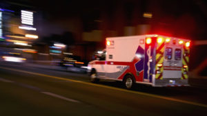 Ambulance on the way to an accident according to an Uber Accident Lawyer Essex County, NJ