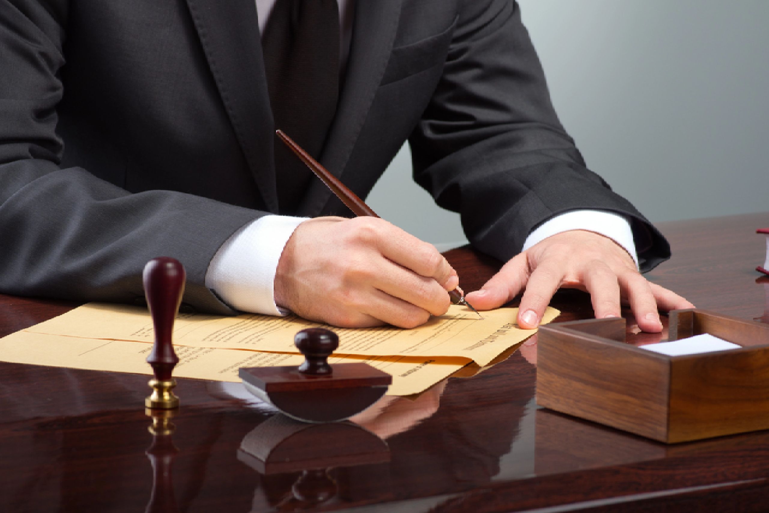 client signing their documents in a court room